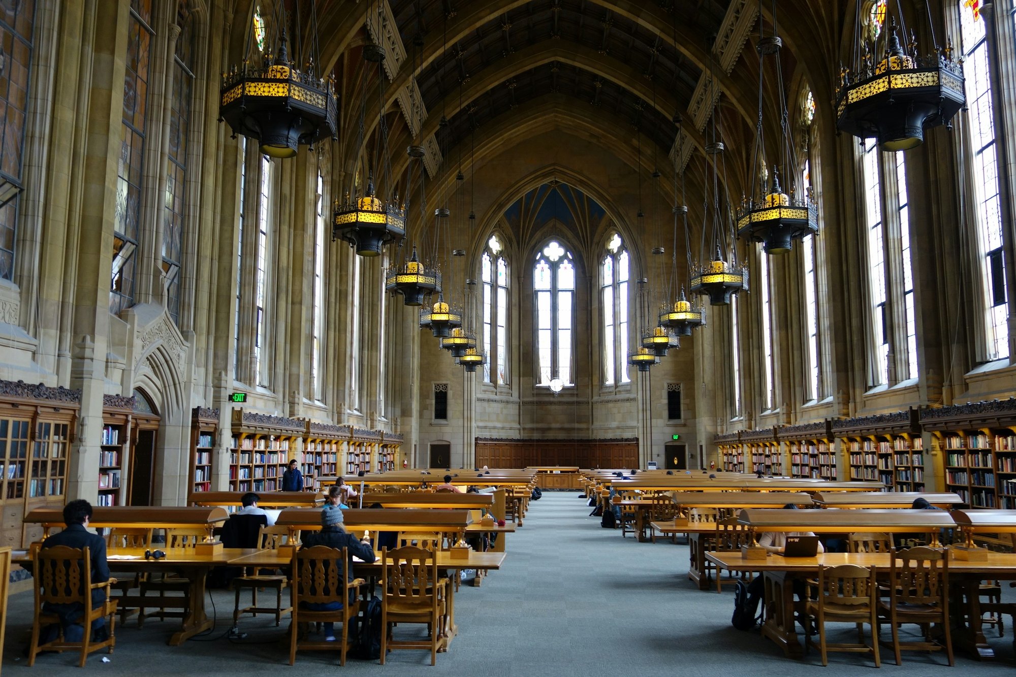 A university reading room with long study tables