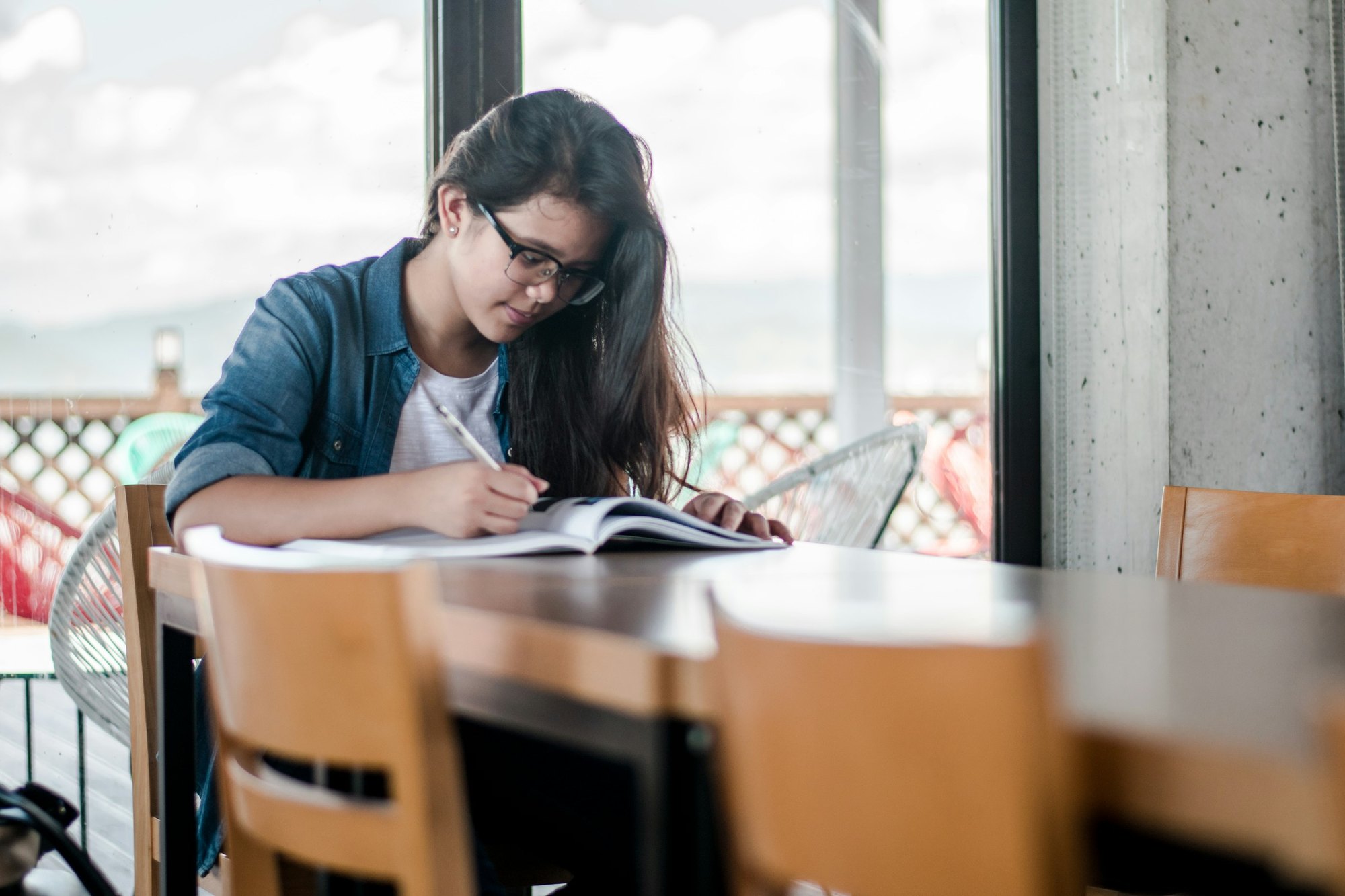 A student studying with a textbook